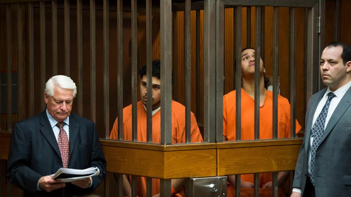Tevita Kaihea, center left, and Charlie Hola, center right, are flanked Thursday in court by their attorneys, Danny Brace, left, and Alexander Asterlin,.