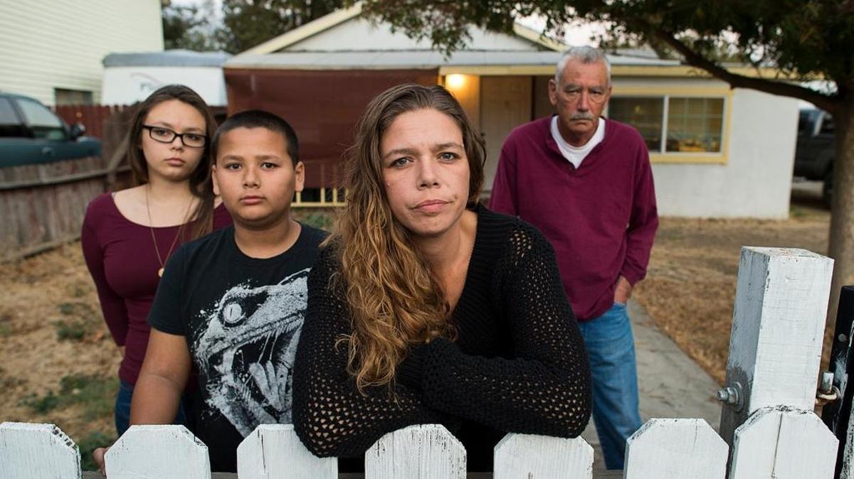 Rita Wages, 35, with her two children Joclyn Namauleg, 15, and Rayzon Ye, 10, and her dad, David Wages, 58, await the fate of her husband, Sareang Ye, on Thursday November 2, 2017 in Woodland, Calif. Her husband, Sareang Ye, was picked up by ICE during a nationwide sweep of Cambodians who are convicted felons. Ye served a sentence about 10 years ago and has been out of trouble since. He’s been told to expect deportation as soon as Monday.