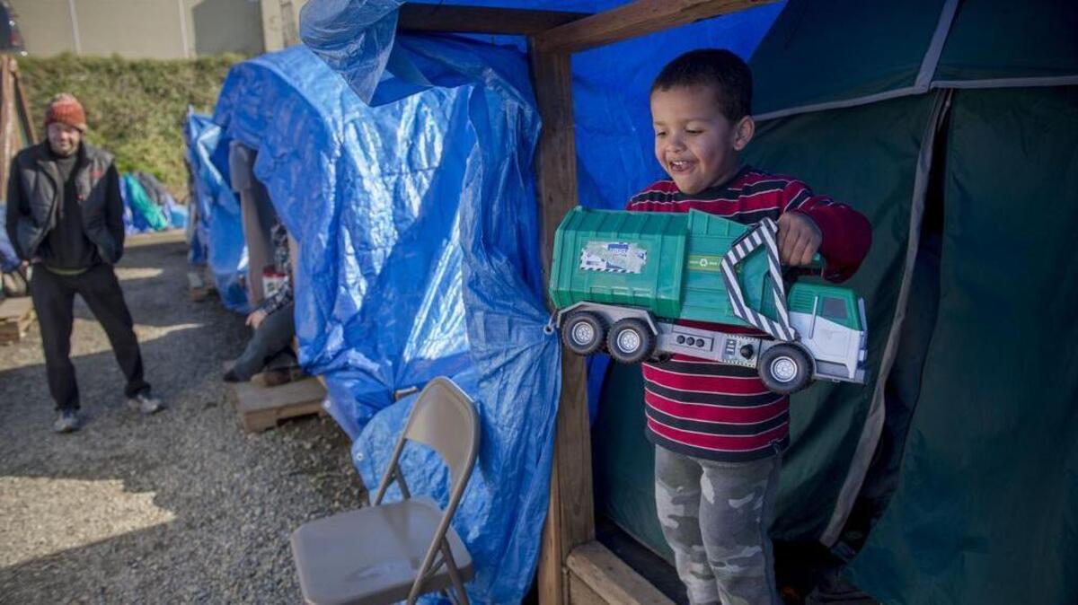 Vincent Merriweather, 4, plays with his toy truck at Tent City 5, one of the city sanctioned homeless encampments located in Seattle’s Interbay neighborhood, Thursday, February 25, 2016.