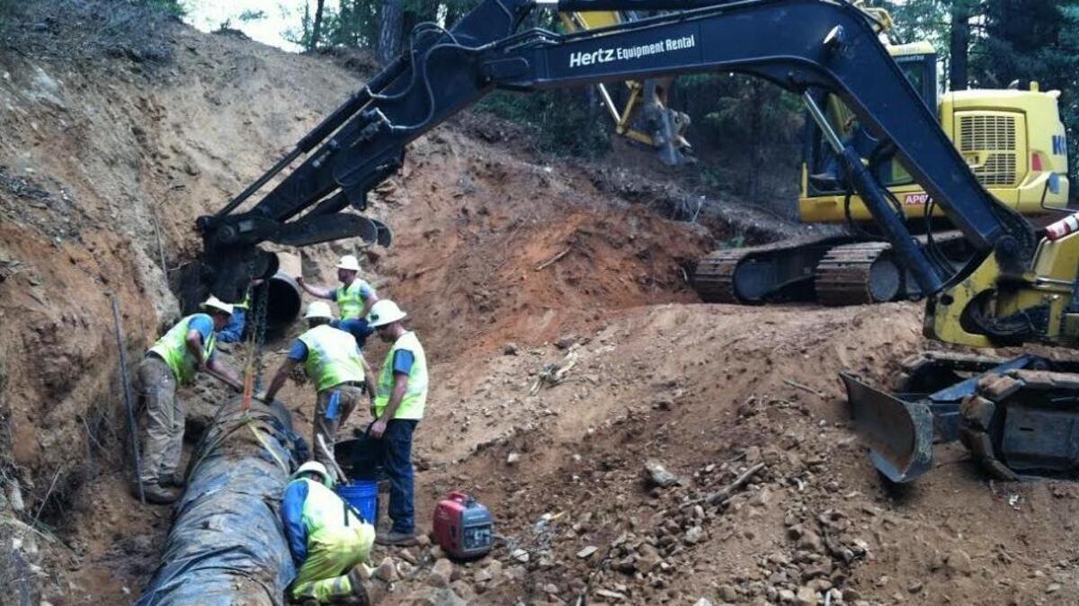 Workers repair pipe in El Dorado County