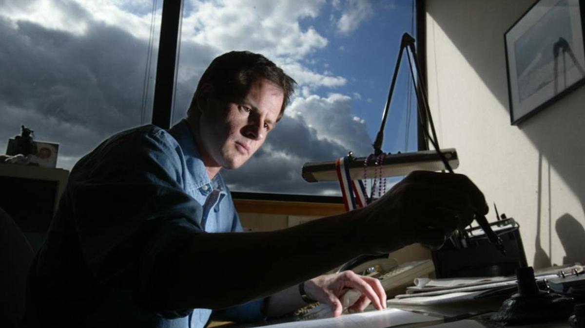 Rex Babin, former editorial cartoonist for The Sacramento Bee, works in his Bee office in 2003.