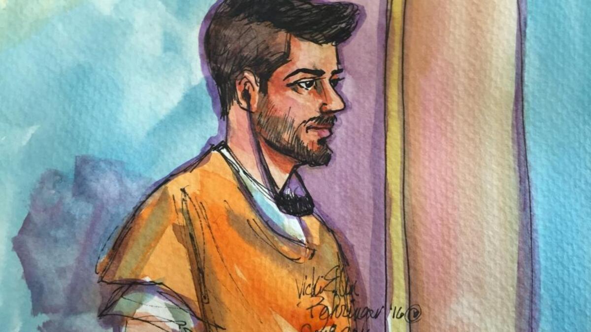 Listening through an Arabic interpreter, Aws Mohammed Younis Al-Jayab appears in Sacramento federal court last week.