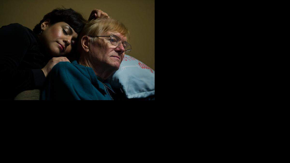 
Faviola Rodriguez embraces Howard Sesser, 72, during a cuddle therapy session at Cuddle Connection last month in Roseville. Sesser is a retired firefighter who lost his wife to multiple sclerosis in 1998 and has struggled to cope ever since. Now, he often drives more than an hour to Roseville in search of comfort from professional cuddlers.
