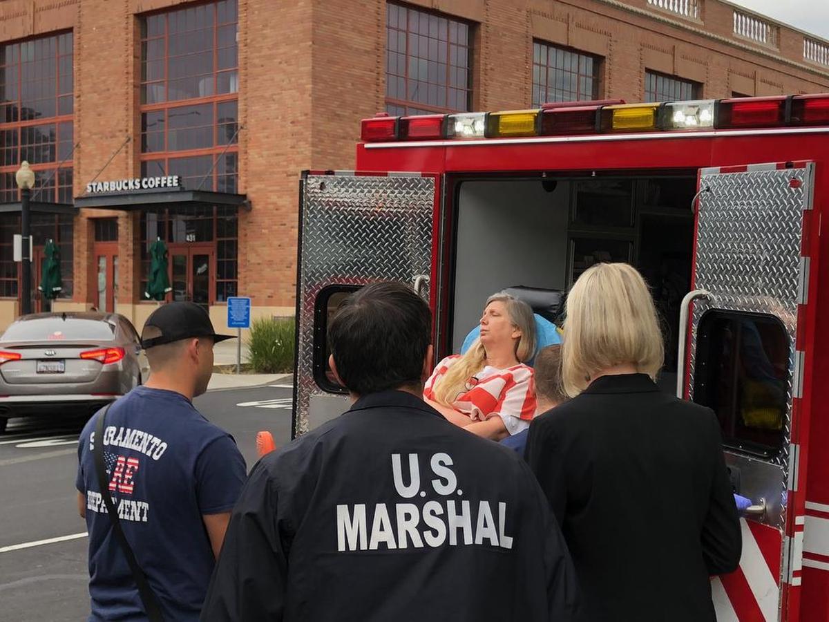 Carissa Carpenter, later convicted of fraud and lying to the FBI, came close to pleading guilty Friday, July 6, 2018 before she fainted in court as she was questioned by U.S. District Judge Garland E. Burrell Jr. She was wheeled out to an ambulance on a gurney.