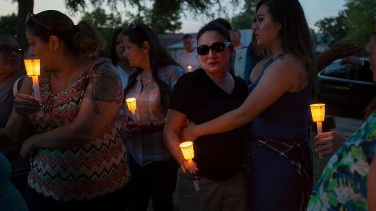 Friends and acquaintances gather for a vigil on May 31, 2016, after 15-year-old Macy Murphy was killed.