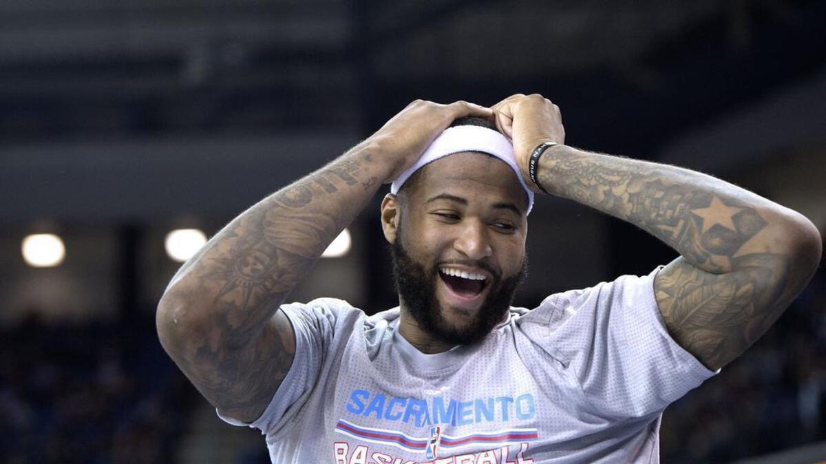 Sacramento Kings center DeMarcus Cousins (15) sits out the closing minutes of the game in their victory over the Suns, but he's happy. Sacramento Kings against the Phoenix Suns during their game at Sleep Train Arena on Friday, March 25, 2016 in Sacramento.