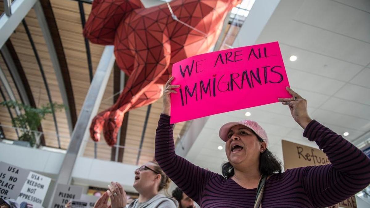 Mona Gustafson of Elk Grove shows her support during a rally at Sacramento International Airport to allow refugees and immigrants to enter the U.S. on Jan. 29, 2017 in Sacramento, Calif.