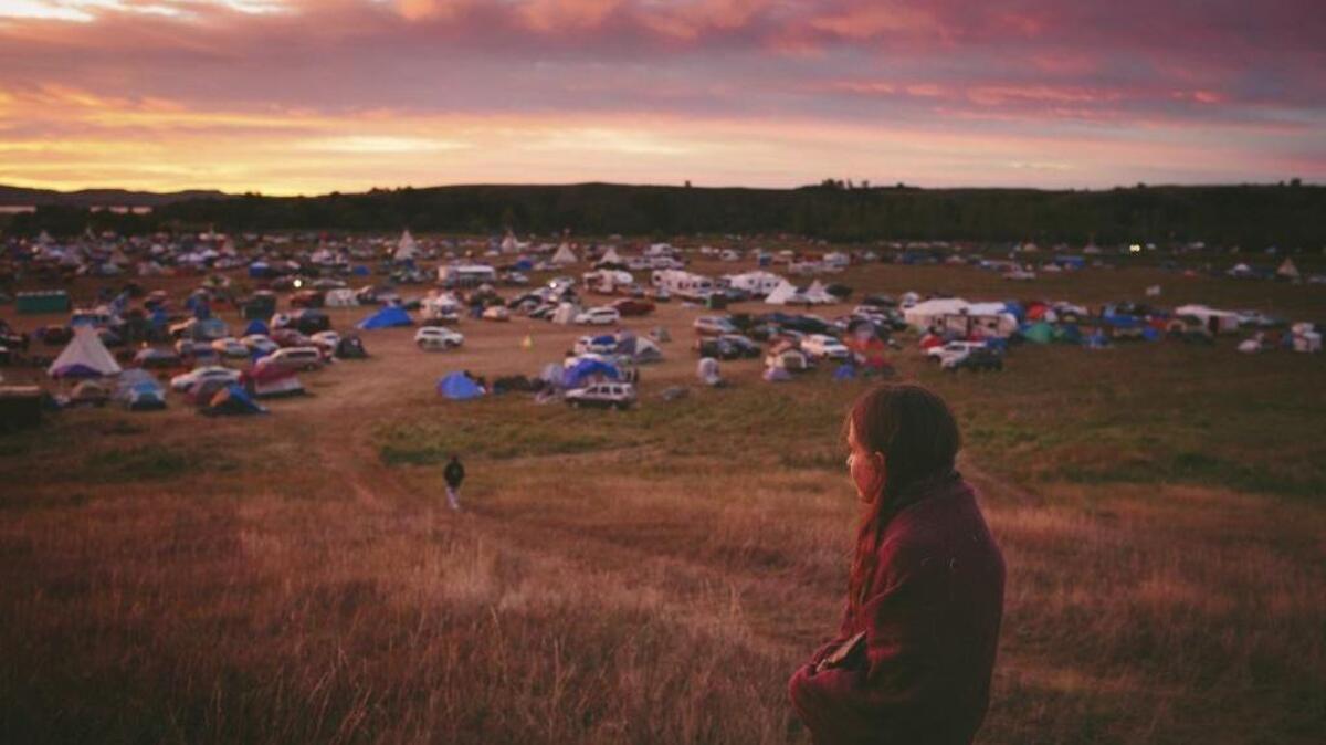 Susan Leopold of the Patawomeck Tribe of Virginia watches the sun rise over the Sacred Stone Camp in Cannon Ball, N.D., in September. Veterans from the Sacramento region are answering a call by Veterans Stand for Standing Rock to travel to North Dakota in support of the Dakota Access Pipeline protesters.