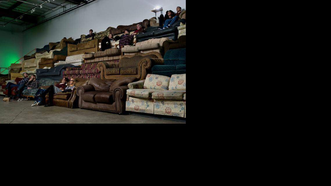 
Art patrons watch a showing of the film “Die Hard” as part of the art installation called “Couchbleachers“ at the Verge Center for the Arts in Sacramento on Friday.
