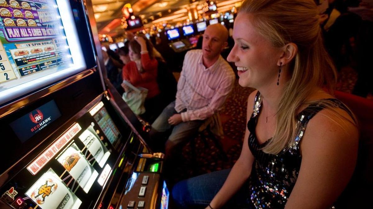 Casey Mayville, far left, Mark Kroon and his fiance Chloe Lee play the slots opening night at Red Hawk Casino in 2008. The tribe that owns Red Hawk won a major court ruling that erased a $30 million jury verdict against the tribe.