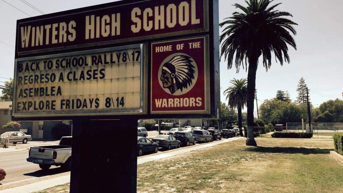 
The older sign in front of Winters High School still displays a traditional American Indian logo. The school has a newer logo featuring a “W” with a feathered spear stuck through it, but residents are debating phasing out the spear, too, in deference to the Yocha Dehe tribe, which has given financial support to the schools. 
