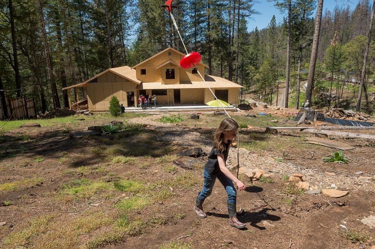 David and Cindy Leonard built a playhouse and a zipline for their daughter Maya, 11, while they lived on their ravaged property on Cobb Mountain in Lake County. Eighteen months after the Valley Fire destroyed their home and possessions, they are rebuilding.