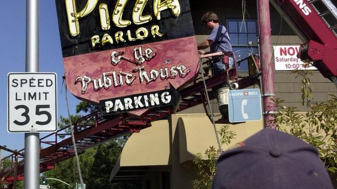 Capitol Neon crew removes Shakey’s Pizza sign Thursday morning June 20, 2002, from in front of what was then the East End Bar and Grill. The building was the beginning for pizza chain that started in Sacramento and the sign was donated to the Sacramento Historical Museum. It will now be housed in Golden 1 Arena.