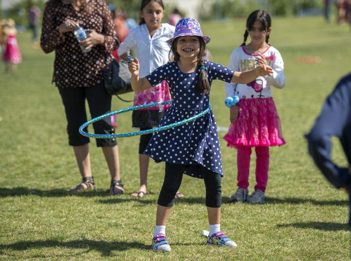 Noureen Rashid, 7, participates in a hula hoop contest during a kite festival at North Natomas Regional Park in 2015.