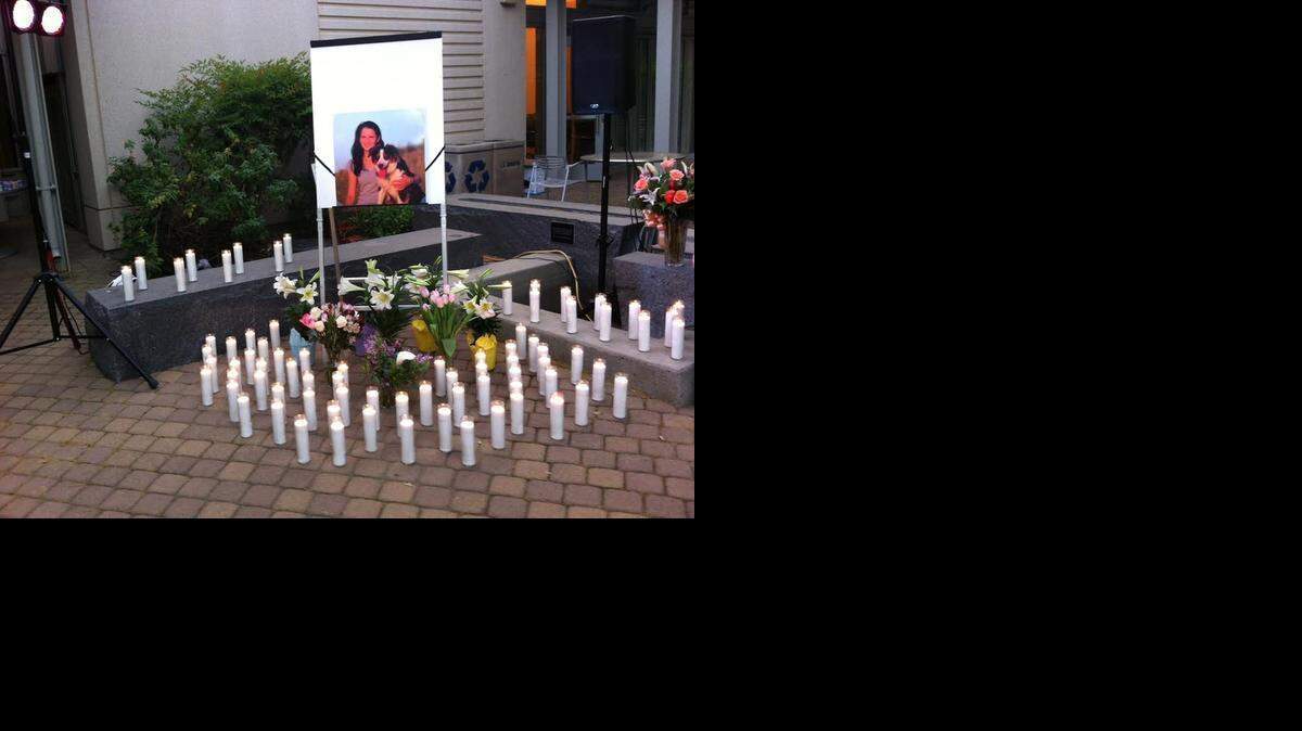 
Candles were placed in a patio in front of Gladys Valley Hall, part of UC Davis’ veterinary teaching compound, at the vigil Saturday night for Whitney Engler.
