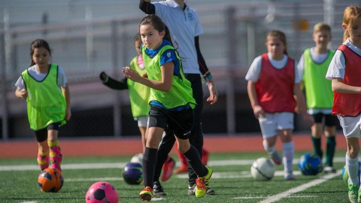 Addison McKinney, 9, practices with other 9-year-olds during Sacramento Soccer Alliance tryouts at Luther Burbank High School in Sacramento on Saturday, Jan. 30, 2016. New rules may split many kids from playing with their classmates due to teams formed based on birth year, while past rules were aligned with the school year. The United States Soccer Federation (USSF), the country's governing body of soccer, announced in August that youth soccer teams will be grouped in age by calendar year.