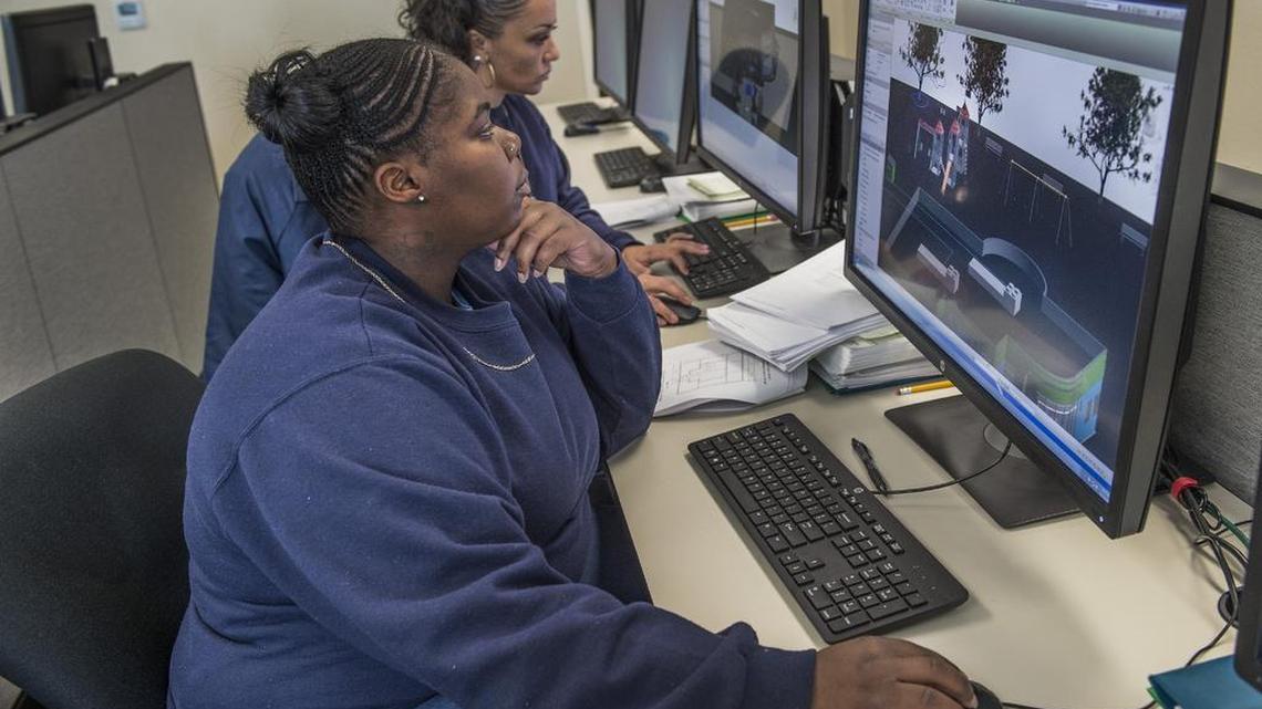 Andreawanna Clemmons, 25, left, and Terese Sheridan, 36, work on a Revit architecture Autodesk course. Certifications in these programs will help offenders obtain jobs in architectural, mechanical or engineering fields upon release.