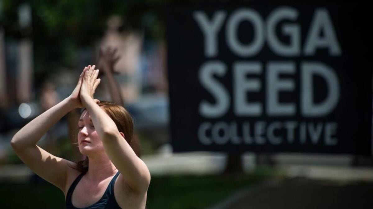 Jen Durkee, an instructor with the Yoga Seed Collective, a local nonprofit dedicated to promoting health consciousness, demonstrates yoga during another giving day on May 3, 2016. This was at the Sacramento region's Big Day of Giving event. Today is Giving Tuesday.