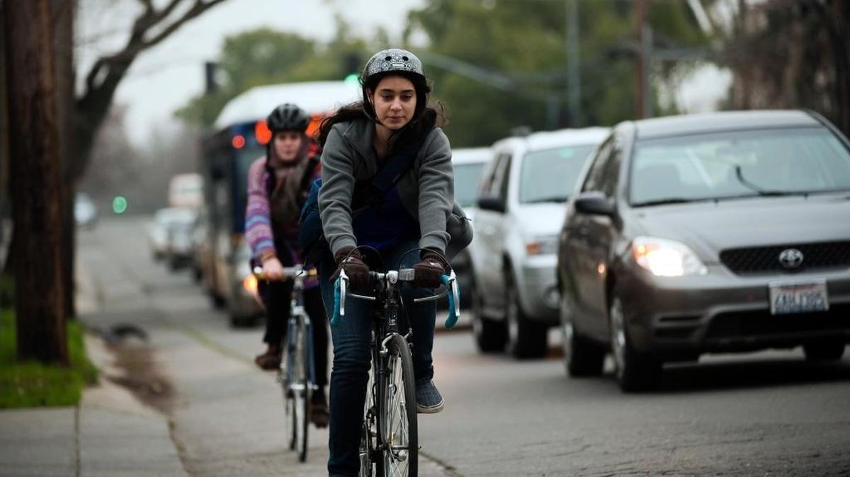 McClatchy High School student Faith Bernstein, 18, rides home from school on Freeport Boulevard in 2009. Bernstein led a student group that urged the city to make Freeport safer for bicyclists.