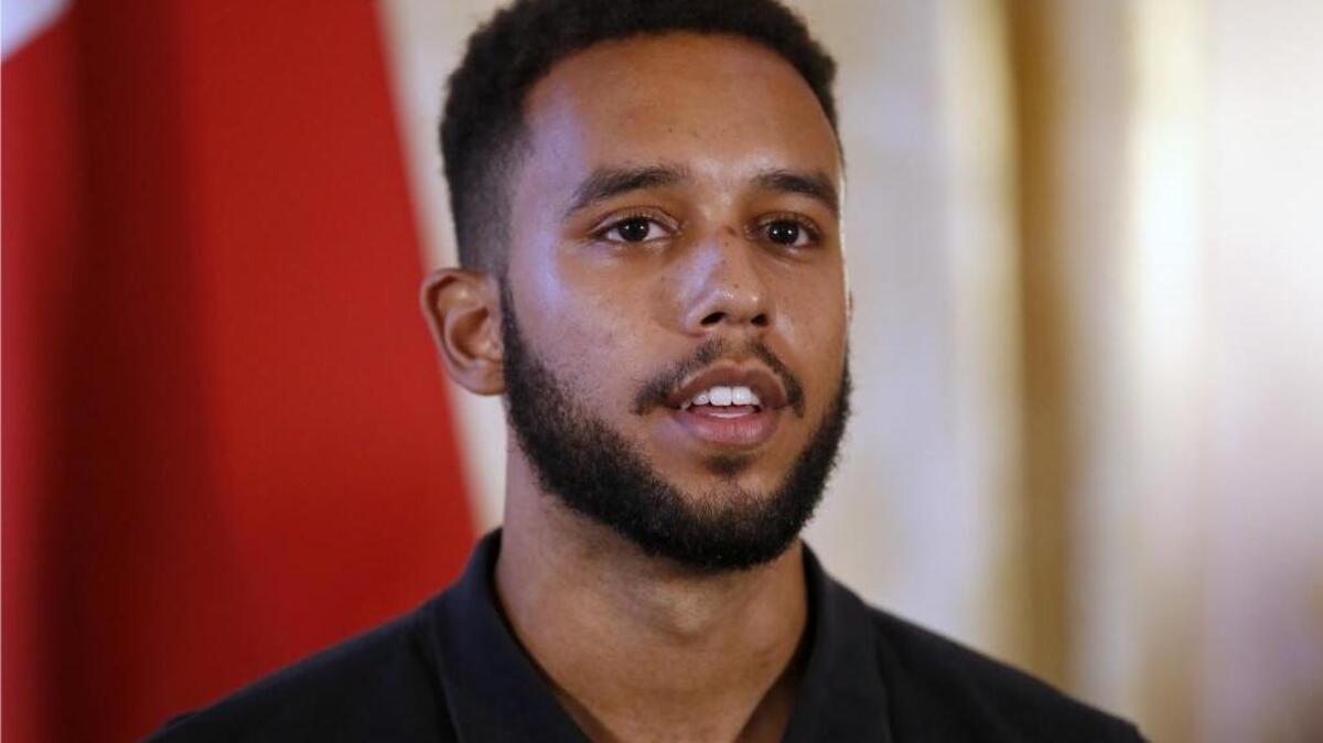 
Anthony Sadler, a senior at Sacramento State University in California, attends a press conference at the U.S. ambassador's residence with Alek Skarlatos and U.S. Airman Spencer Stone, in Paris, France, Sunday, Aug. 23, 2015. Sadler, Skarlatos and Stone helped foil a potentially deadly attack when they subdued a man armed with an assault rifle and other weapons on board a high-speed train bound for Paris.
