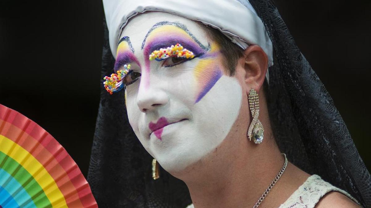 Sister Bonnie Appetite, of the Capitol City Sisters of Perpetual Indulgence, walks in the Sac Pride Parade 2017 in downtown Sacramento, California, on June 3, 2017. The organization, which originated in San Francisco in 1979, now is represented in 70 cities around the world.