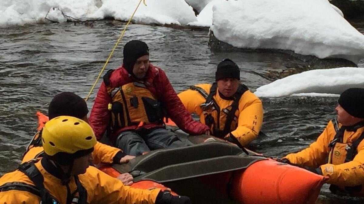 Rescuers take Derrick Dionno across a waterway Saturday in El Dorado County.