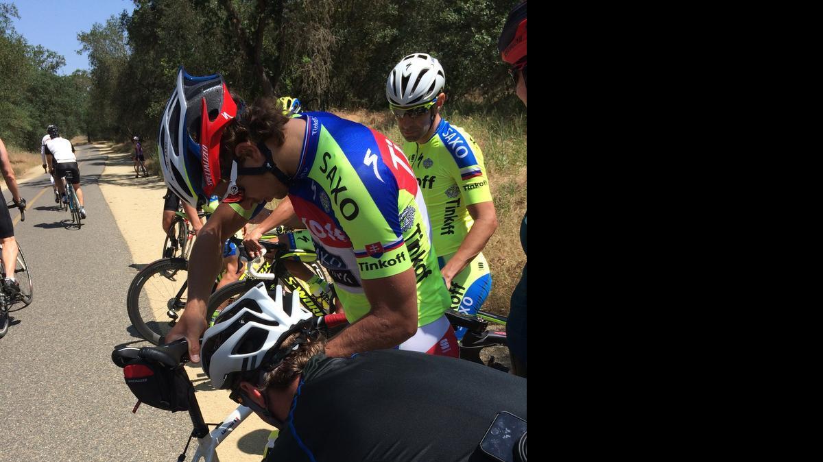 
Peter Sagan gets help putting his chain back on his bike after a bike crash on the American River bike trail caused Sagan and several cyclists training for Sunday’s Amgen race to fall. 
