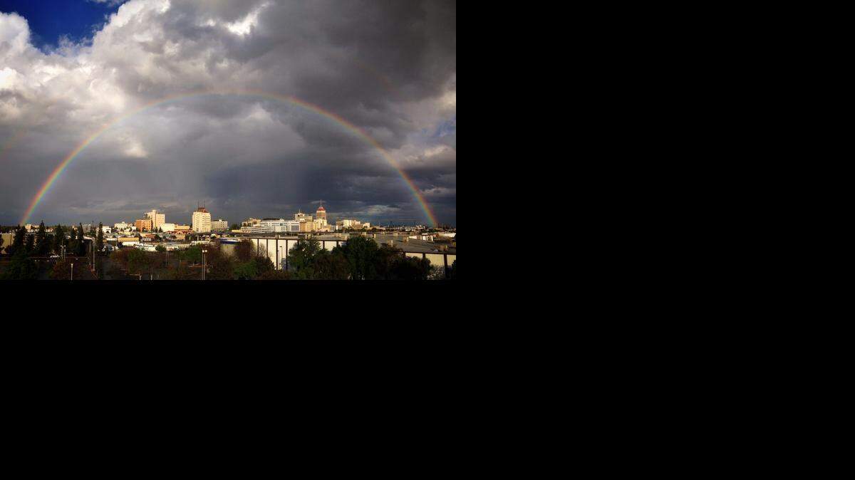 
A complete rainbow arcs over downtown Fresno as seen in this iPhone panorama Wednesday, March 26, 2014. But this weekend, the skies will be sunny and temperatures warm.
