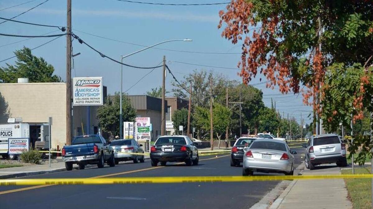 
Modesto police vehicles are on post near a warehouse where eight people were wounded and one person was killed in a shooting early Sunday morning.

