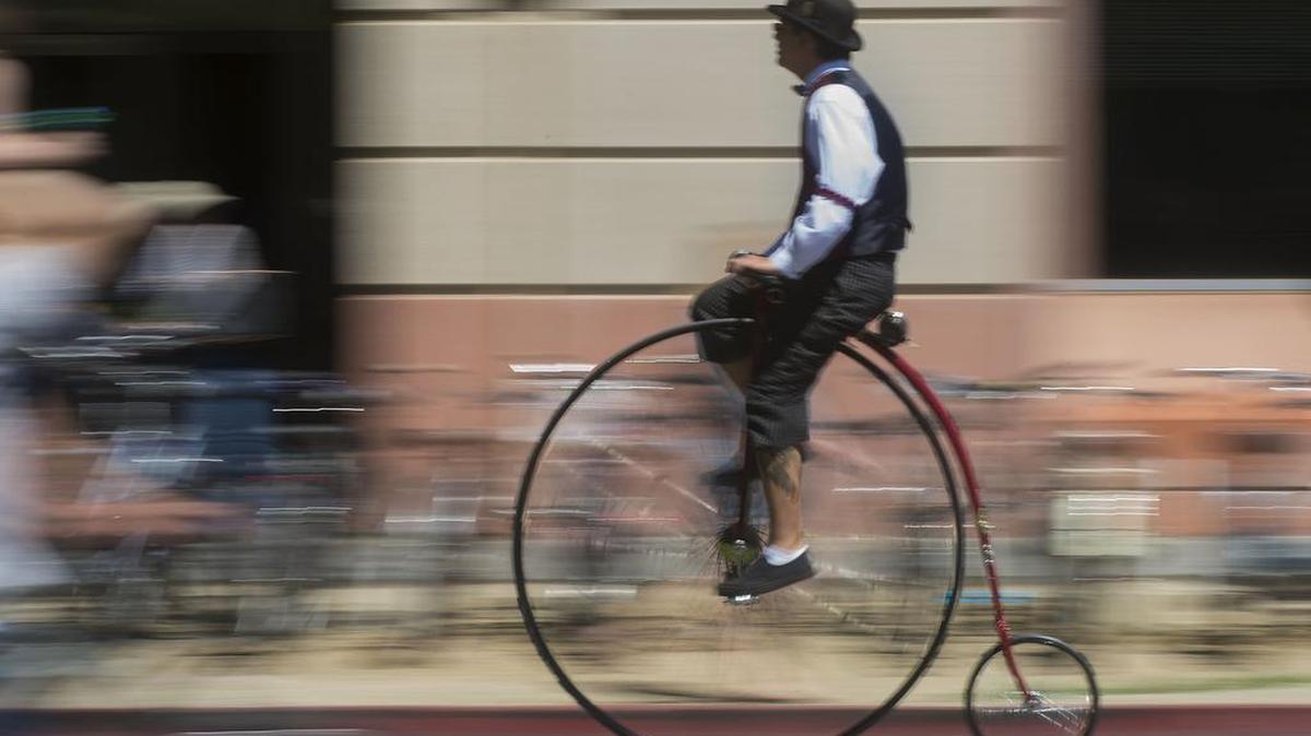 A man pedals a high-wheel bicycle through the campus during the Picnic Day activities at UC Davis in Davis on Saturday, April 16, 2016.
