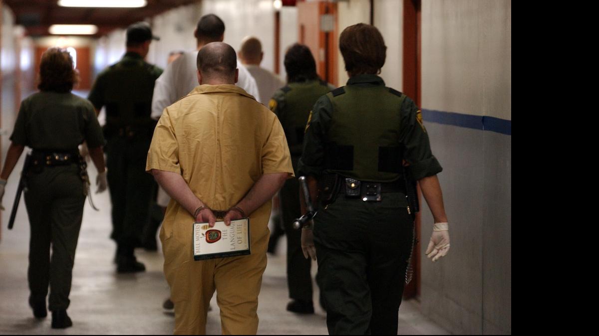 
Correctional officers escort inamtes at Pelican Bay to their cells.
