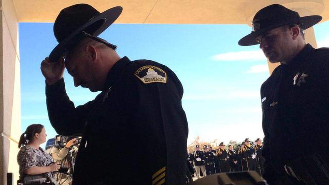 
Sacramento County sheriff’s deputies enter a Roseville church where services for their slain colleague Danny Oliver were held Monday.
