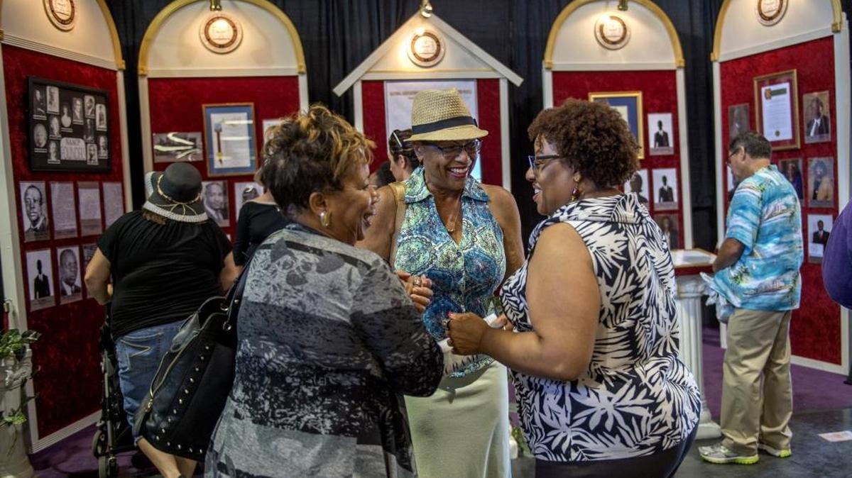 Betty Williams, left, who served as president of the local chapter of the NAACP from 2004 to 2012, and Aliane Murphy-Hasan, the local chapter secretary, center, chat with Cynthia Brooks, right, the curator of the “A Century of Civil Rights” exhibit at the California State Fair on Sunday, July 10, 2016, in Sacramento, Calif.