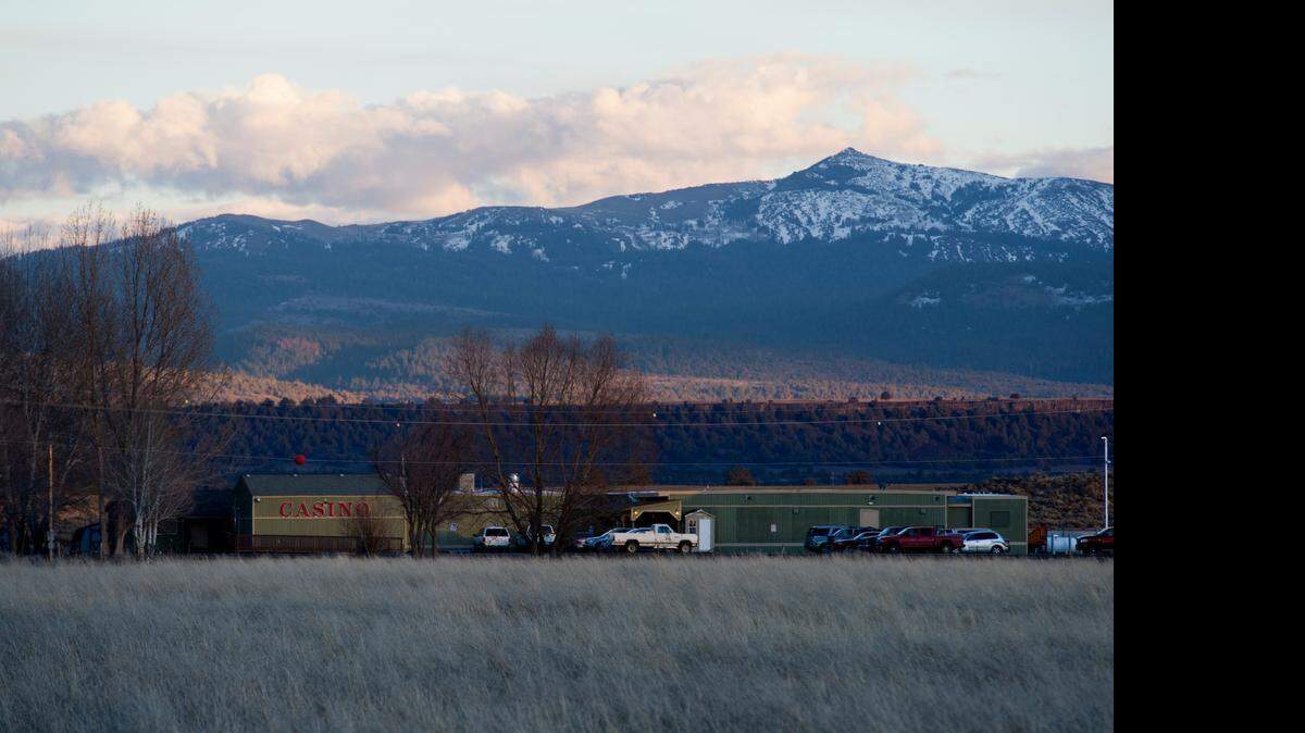 <caption>At left, the Alturas Rancheria’s would-be casino in Yreka, 165 miles east of the Modoc County rancheria, sits empty near Interstate 5 after the federal Bureau of Indian Affairs refused to approve it. The tribe, which operates the Desert Rose Casino in Alturas, at right, has faced a series of disputes over who can be a member and who receives money from rancheria operations. </caption>