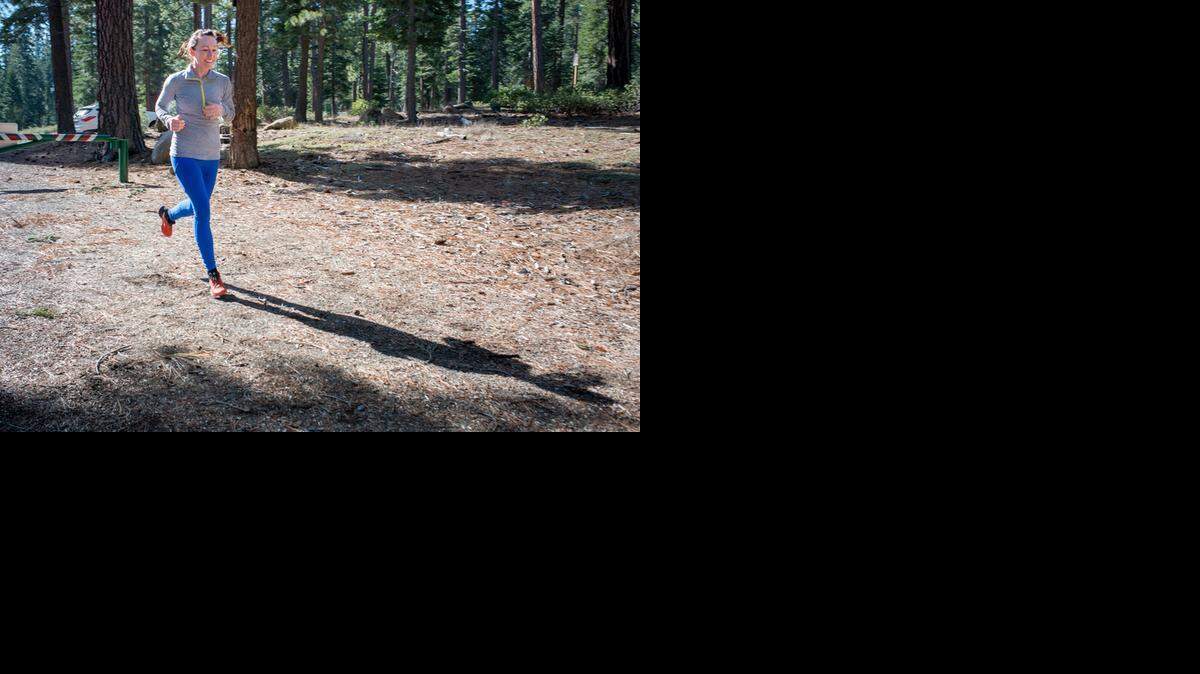 
Danielle Brooks, 33, of Carnelian Bay jogs back home from the post office on Thursday, Feb. 12, 2015. While there is snow at higher elevations, the lack of snow at lake level has some people feeling like there is a seasonal purgatory.
