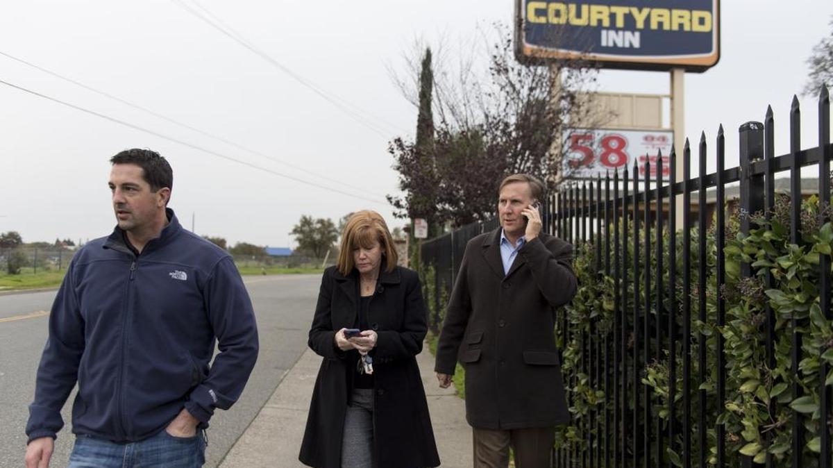 Ron Linthicum and Joy Smiley, right, look for signs of prostitution and drug use with small business owner Seth Astle near Watt Avenue on Wednesday, Dec. 7, 2016, in Sacramento, Calif. Linthicum and Smiley are community prosecutors with the Sheriff's north division office. Their work focuses on nuisance properties like hotels with obvious signs of prostitution and drug use or landlords with numerous code violations.