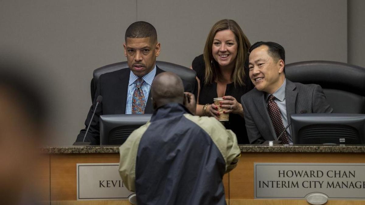 Interim City Manager Howard Chan, right, appears on the dais with former Sacramento Mayor Kevin Johnson and Councilwoman Angelique Ashby before the City Council meeting on Dec. 6.