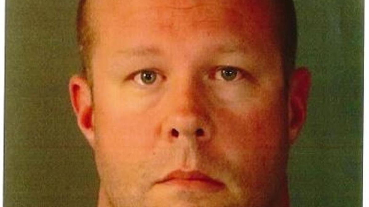 Booking photo of Officer Brad Alford, 41.