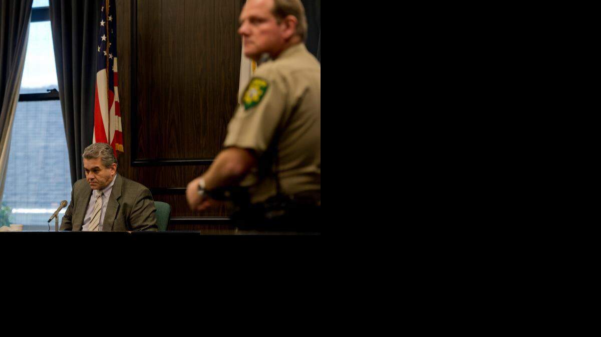 
Todd Winkler waits for the session to begin for his afternoon testimony while on trial for the murder of his wife, Rachel Winkler, on Thursdayin Placerville. While he testified, court security was seated between him and the jury box. Often tearful during his testimony, he relied on the tissue box supplied by the court. 
