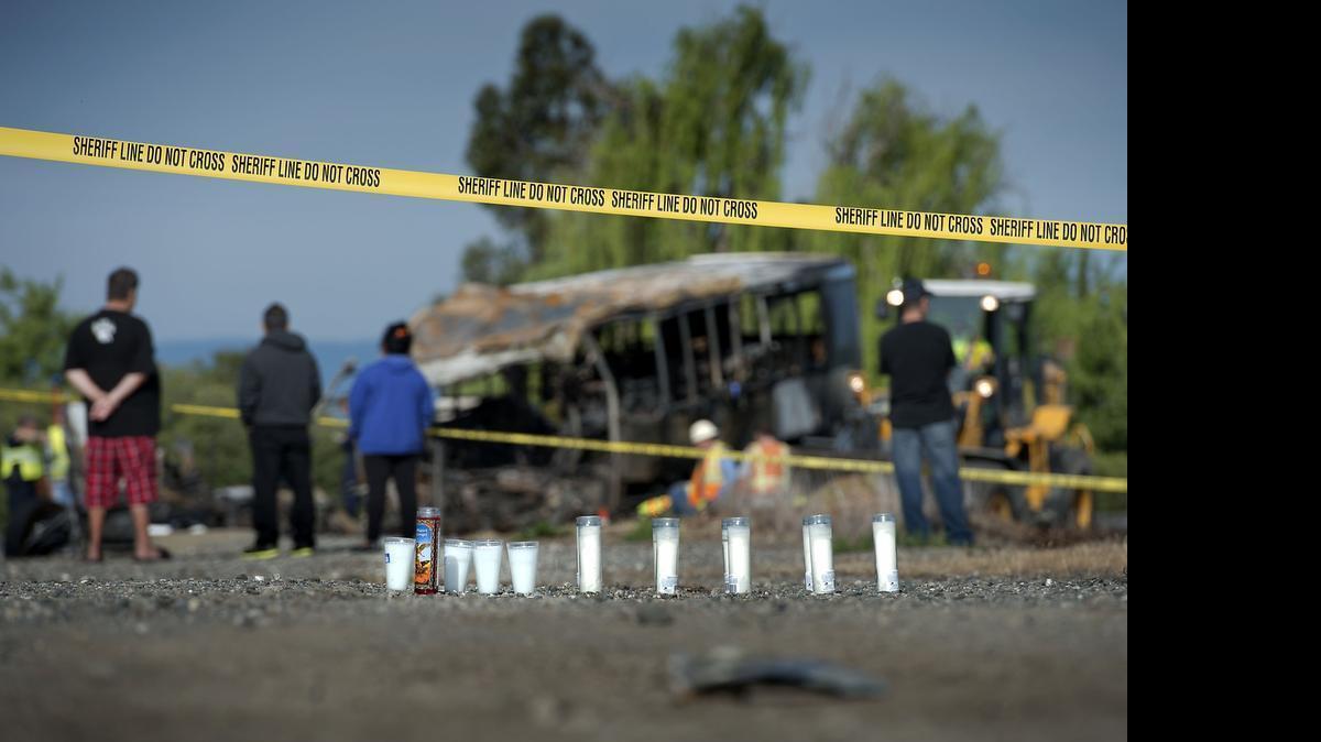
A row of candles were set on a dirt road near the crash site.
