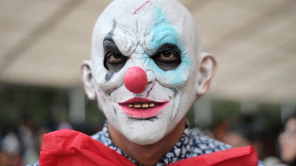 A killer clown look-alike takes part in last week’s “Zombie Walk” parade in Mexico City, Mexico. A Washington State University expert says several factors could play into the motives of “deviant” clowns, including distress and anxiety, social contagion and a desire to be noticed. (