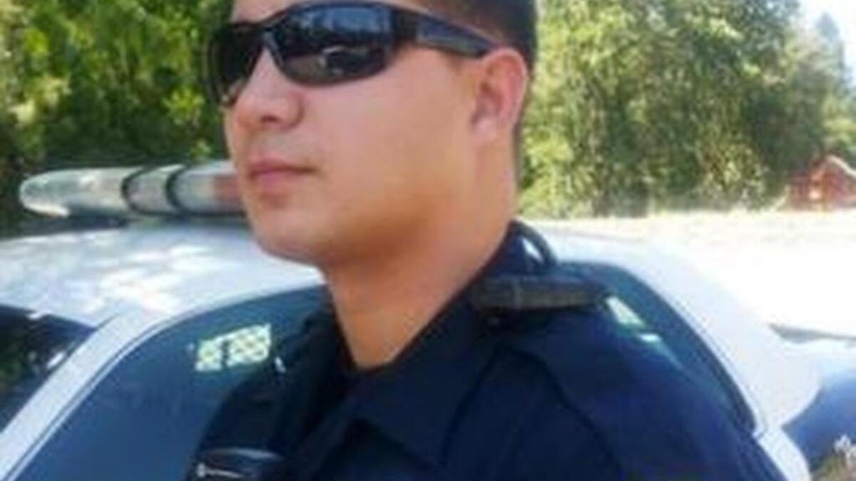 
A Placerville police officer wears a body camera on his collar. 
