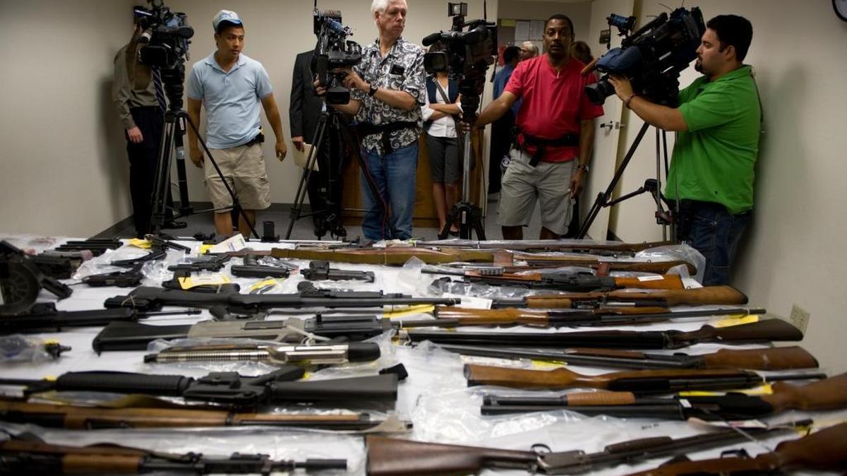 56 guns and hundreds of rounds of ammunition were on display at the Sacramento Police Department Property Warehouse that were taken off the streets in early 2008. Photo taken August 12, 2008.