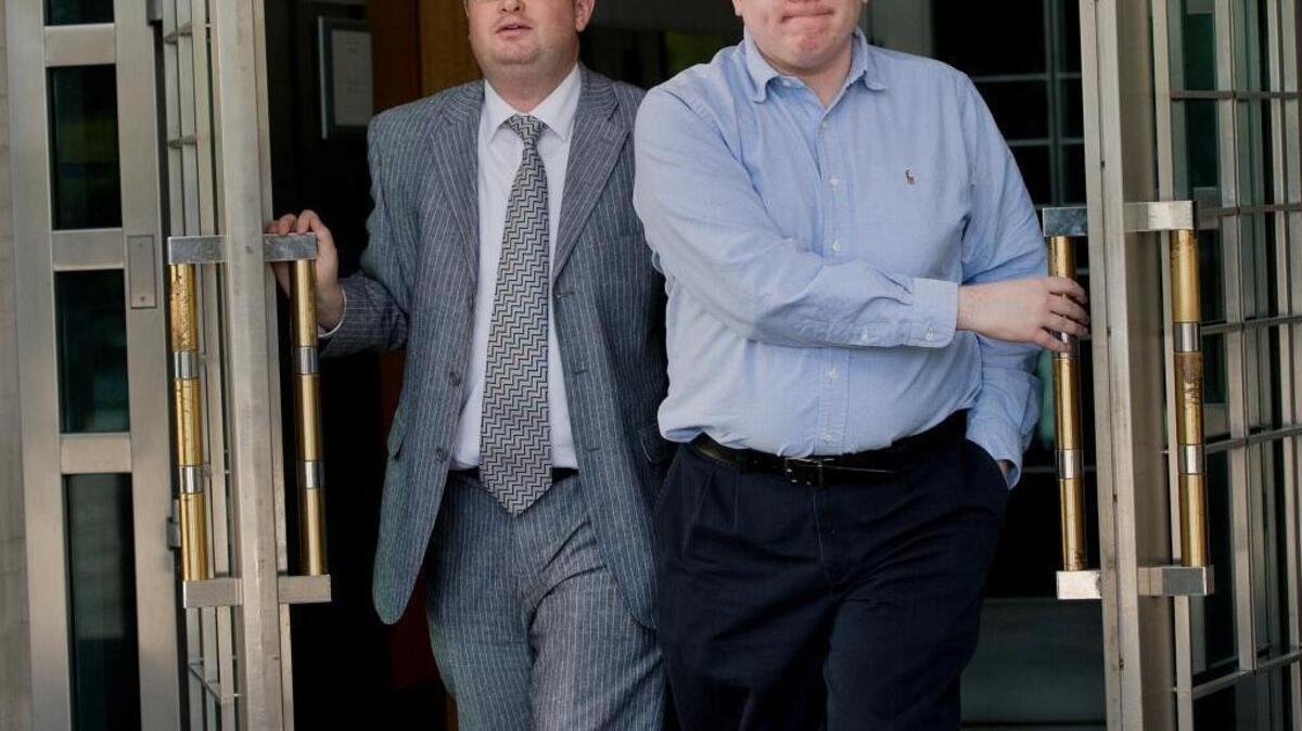 
A trial of Matthew Keys, right, started in federal court Monday. He is shown here in April 2013 leaving the federal courthouse in Sacramento after his arraignment with lawyer Jason Leiderman.
