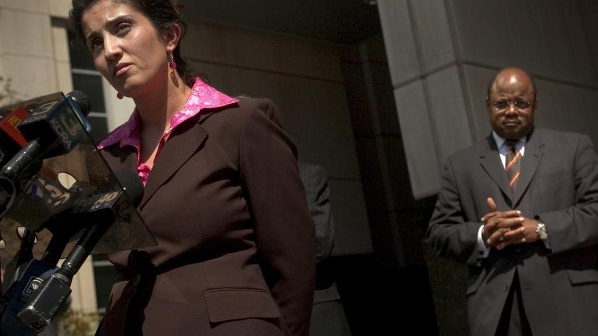 Attorney Wazhma Mojaddidi talks about Hamid Hayat while attorney Johnny L. Griffin III listens in front of the federal courthouse in Sacramento on April 28, 2006.