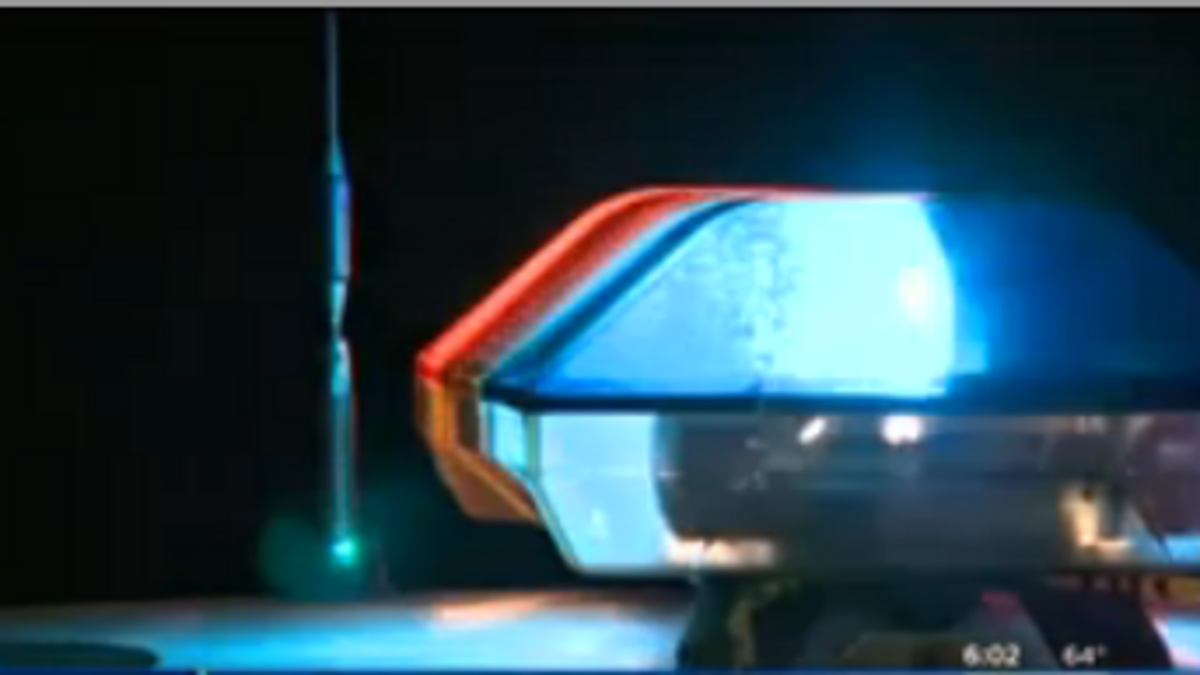 Police lights from a unit at the scene on Thursday night.