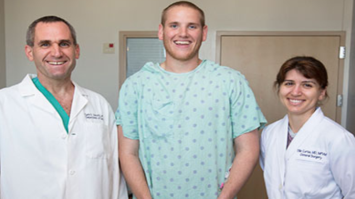 
Airman Spencer Stone is flanked by Garth Utter, associate professor of surgery, and Eleanor Curtis, fourth-year surgery resident at UC Davis Medical Center.

