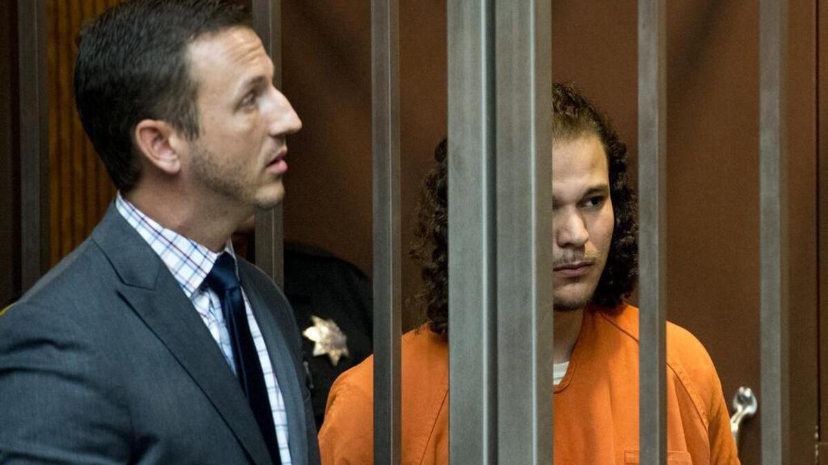 Elijah Ray Lambert, right, is advised by his lawyer, Byron Roope, during his first appearance in the Sacramento Superior Court in 2015 in Sacramento.