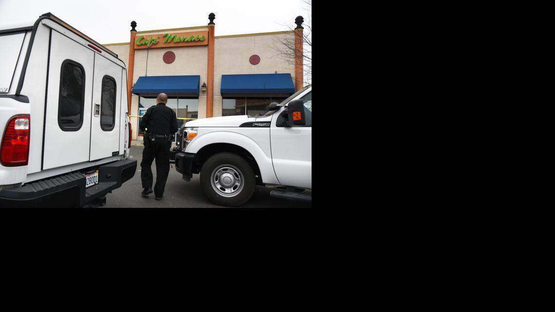 
A Sacramento County crime scene investigator investigates a shooting early Friday at the Cafe Monaco in the Little Saigon section of Sacramento County. 

