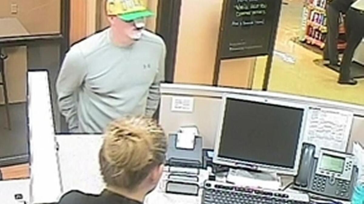 A surveillance photo shows a man with bandages on his face who reportedly robbed the US Bank inside a Safeway store in Rocklin.